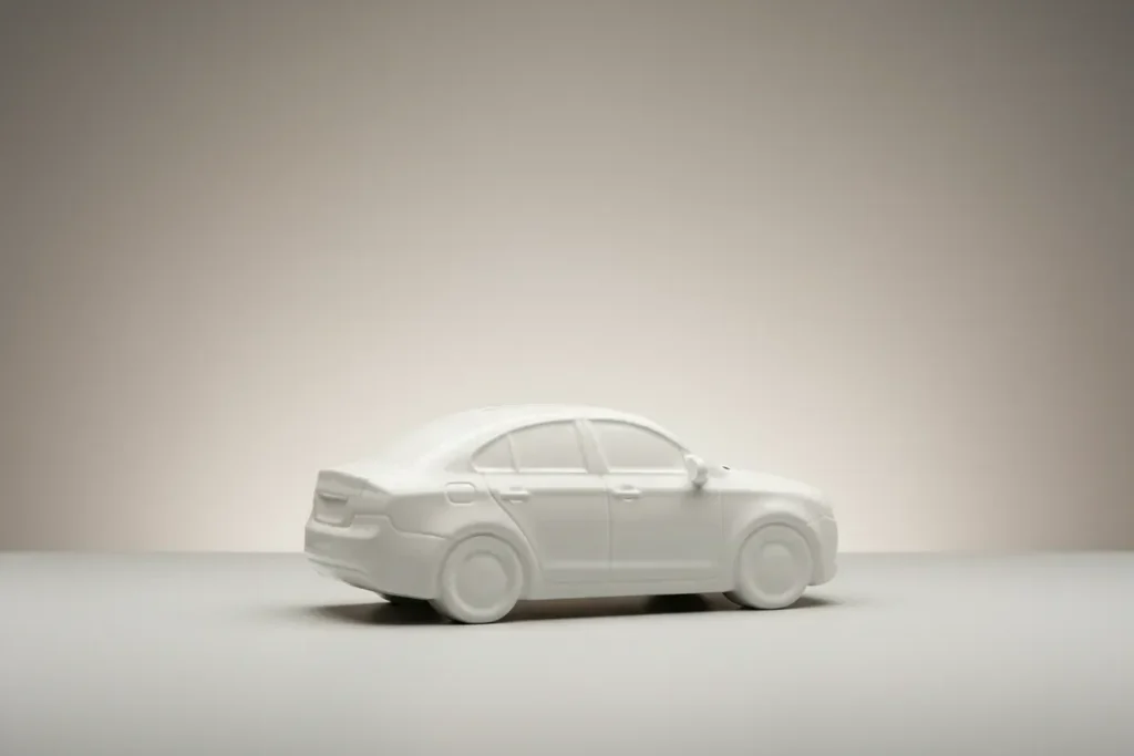 White car-shaped piggy bank on a soft neutral background, symbolizing auto loan cost and interest.